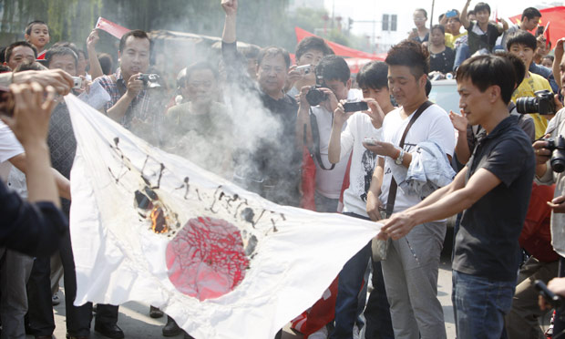 In 2012, when 14 pro-China activists entered the waters, though only  5 swam ashore, all were detained by the Japanese coastguard, and deported.Chinese protesters burn a Japanese flag in Henan province