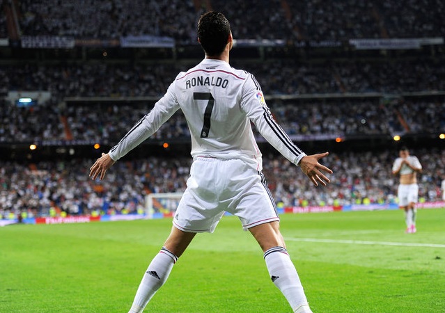 MADRID, SPAIN - OCTOBER 05:  Cristiano Ronaldo of Real Madrid celebrates after scoring his team's 5th and his third goal against Club Athletic during the La Liga match between Real Madrid CF and Athletic Club at Estadio Santiago Bernabeu on October 5, 2014 in Madrid, Spain.  