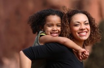 Mother's day Brazil: Mother holds child on her back