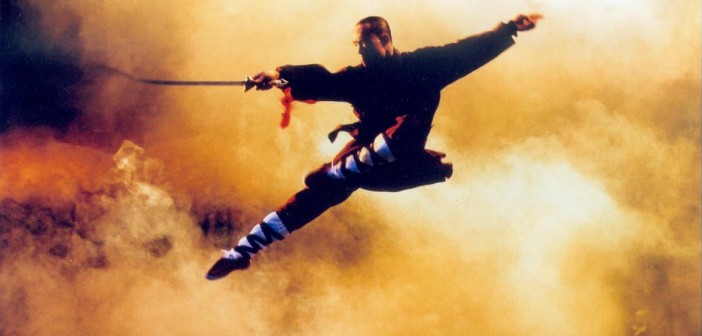 Kung fu fighter jumps with a sword
